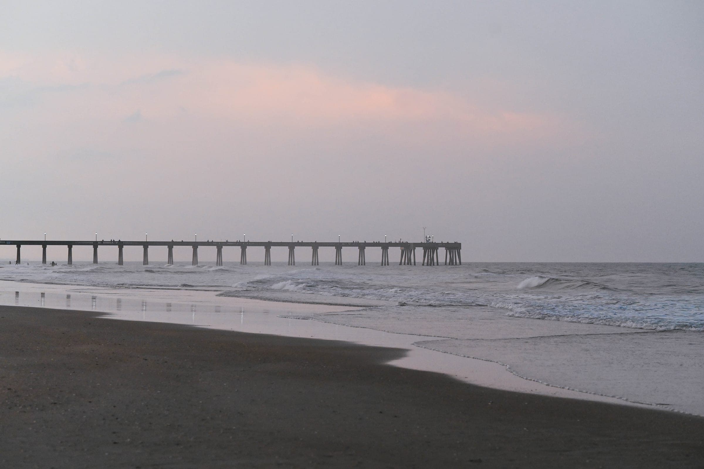 Surf City Pier on Topsail Island at dusk, the busy middle of the island