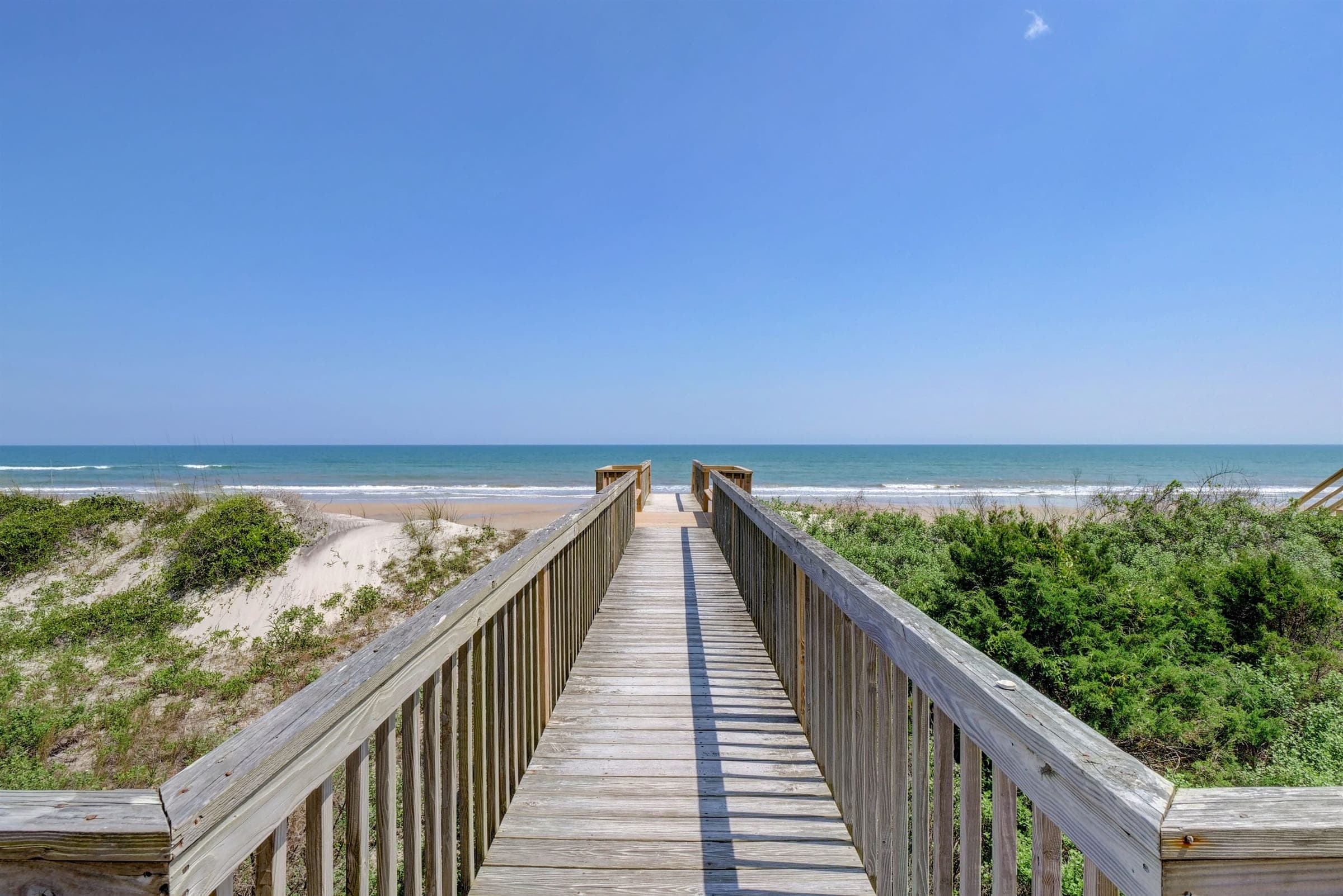 A private dune walkway leading down to an empty North Topsail beach